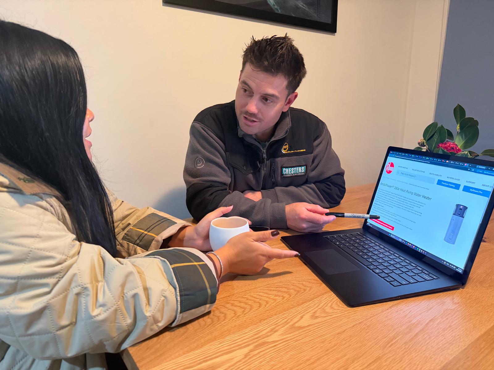 Nevflow plumber explaining a flat-rate quote to a customer