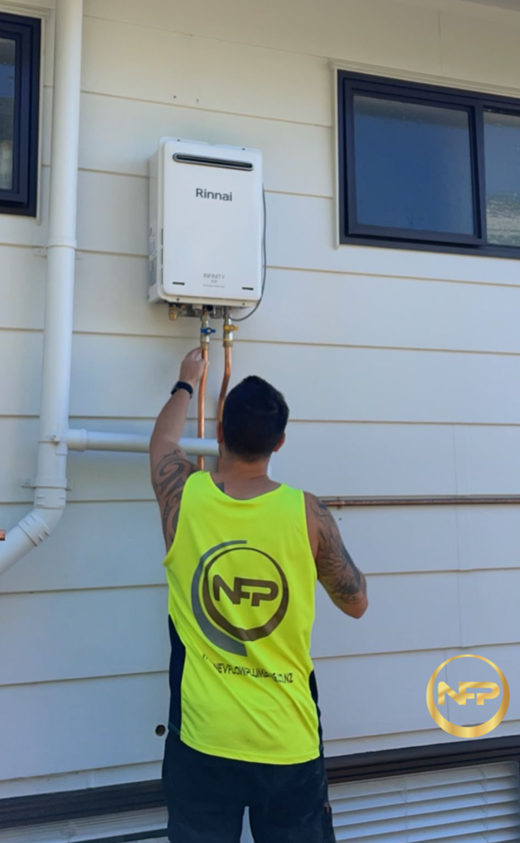 Nevflow plumber servicing an exterior gas water heater